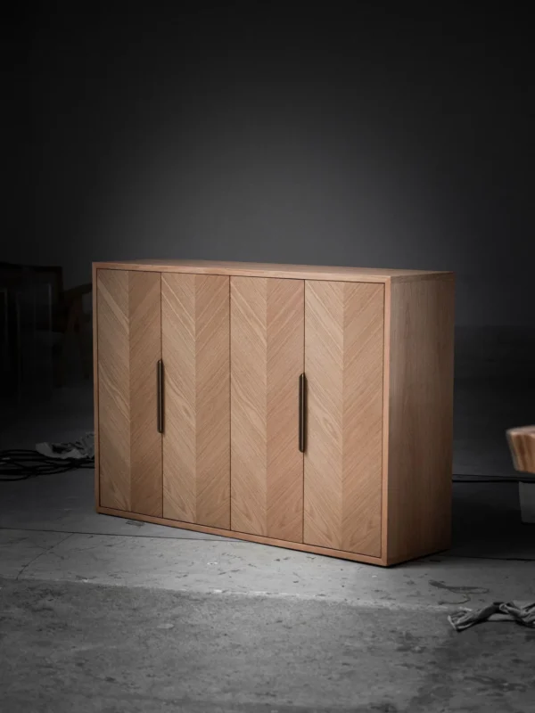 White Oak Herringbone Four-Door Sideboard in natural oak — in a room setting