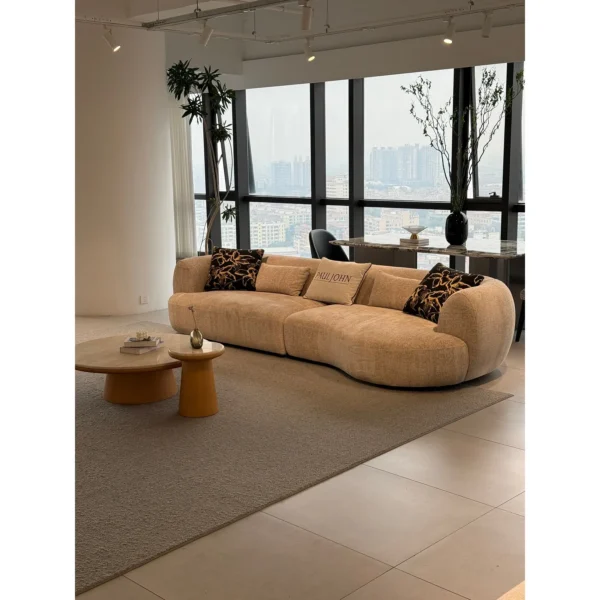 Cashew Curved Sofa in Oatmeal Chenille with Wide Rounded — in a room setting