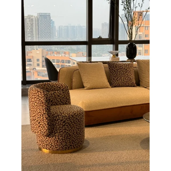 Wild Leopard Linen Barrel Lounge Chair on Brass Base in clay — in a room setting