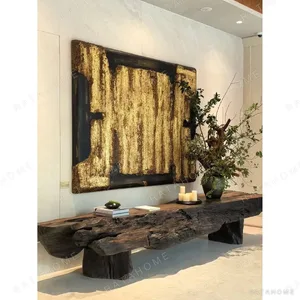 Carved Wood and Gold Leaf Abstract Wall Art in brushed brass — in a room setting