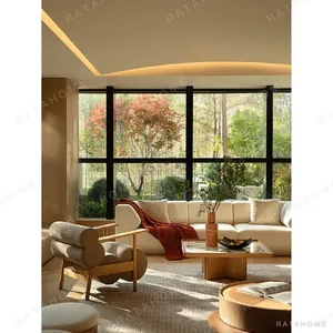 Low Oak Lounge Chair with Olive Leather Roll Cushions in natural oak — in a room setting