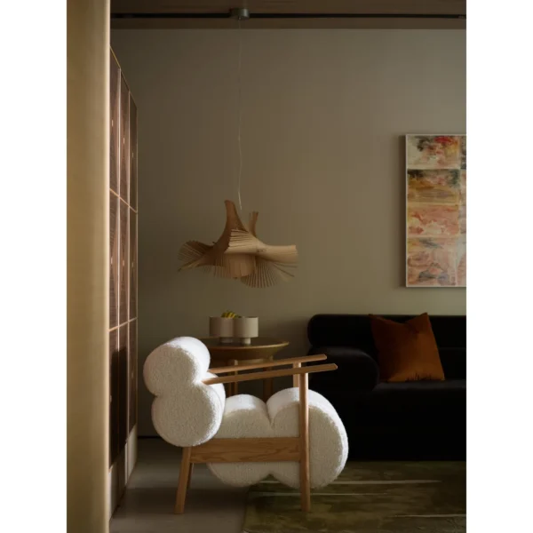 Low Oak Lounge Chair with Olive Leather Roll Cushions in natural oak — in a room setting