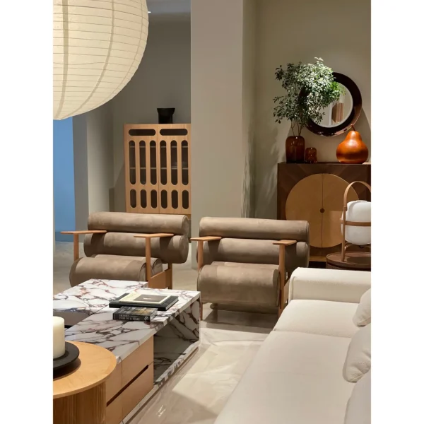 Low Oak Lounge Chair with Olive Leather Roll Cushions in natural oak — in a room setting