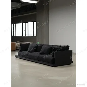 Wunian Black Sofa with Chunky Solid Wood Frame and Deep in black — in a room setting