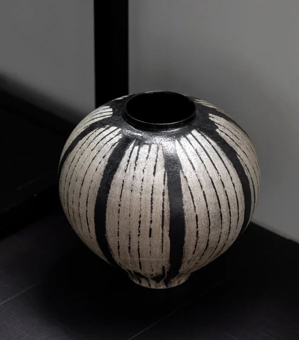 Artist Collaboration Hand-Painted White Line Sphere Vase in black — in a room setting