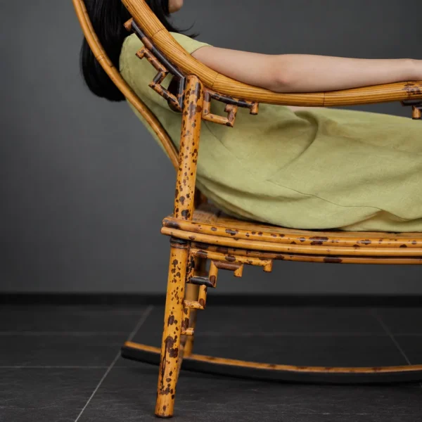 Xiangfei Mottled Bamboo Rocking Chair in clay — in a room setting