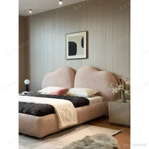 Xinyu Heart-Shaped Headboard Bed in rose stone — in a room setting