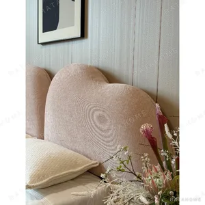 Xinyu Heart-Shaped Headboard Bed in rose stone — in a room setting