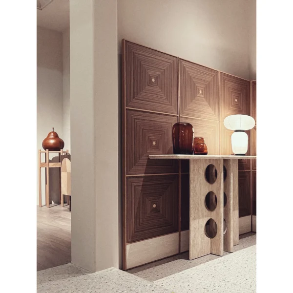 Xuanji Travertine Console with Split-Circle Base in oatmeal — in a room setting
