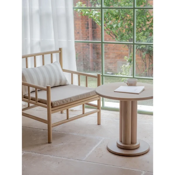 Xumu Ash Spindle Lounge Chair in natural oak — in a room setting