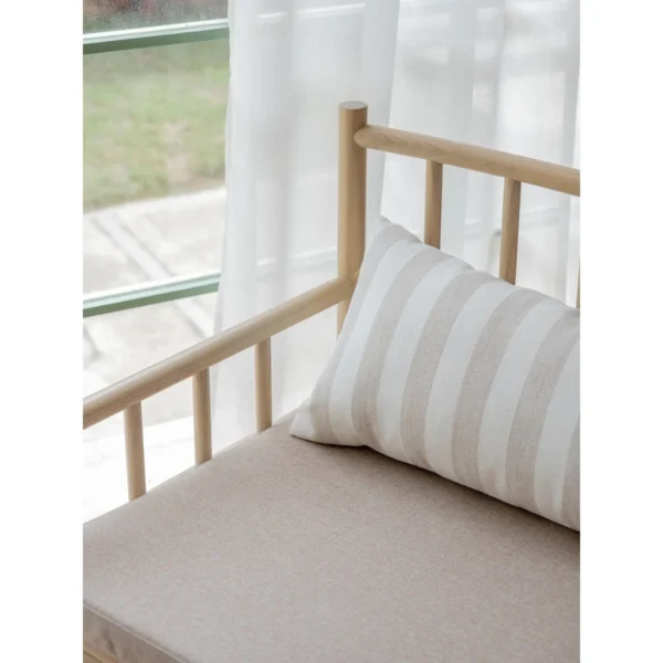 Xumu Ash Spindle Lounge Chair in natural oak — in a room setting