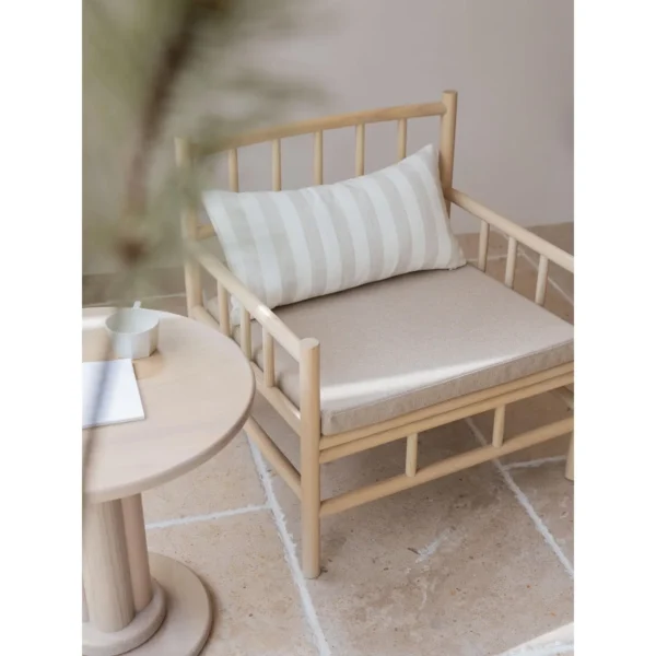 Xumu Ash Spindle Lounge Chair in natural oak — in a room setting