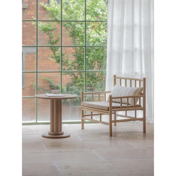 Xumu Ash Spindle Lounge Chair in natural oak — in a room setting