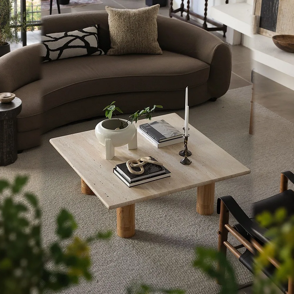 Yellow Travertine Square Coffee Table on Round Legs in sand — front view