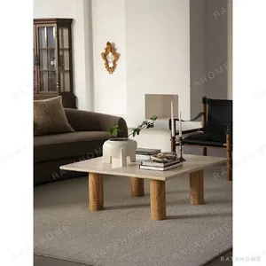 Yellow Travertine Square Coffee Table on Round Legs in sand — in a room setting