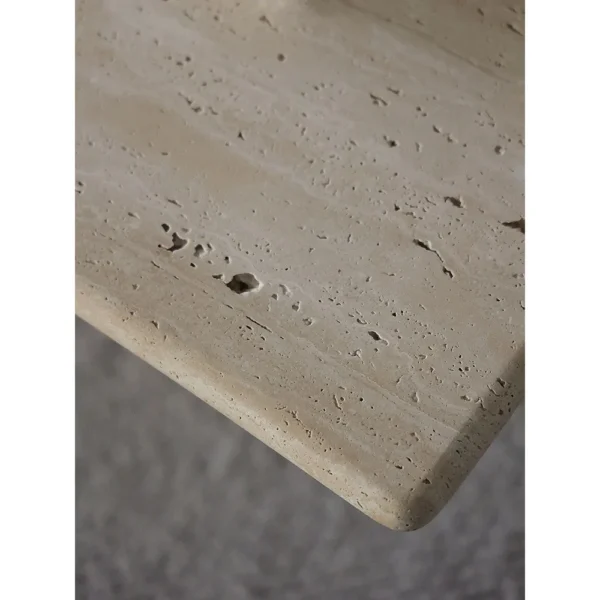 Yellow Travertine Square Coffee Table on Round Legs in sand — in a room setting