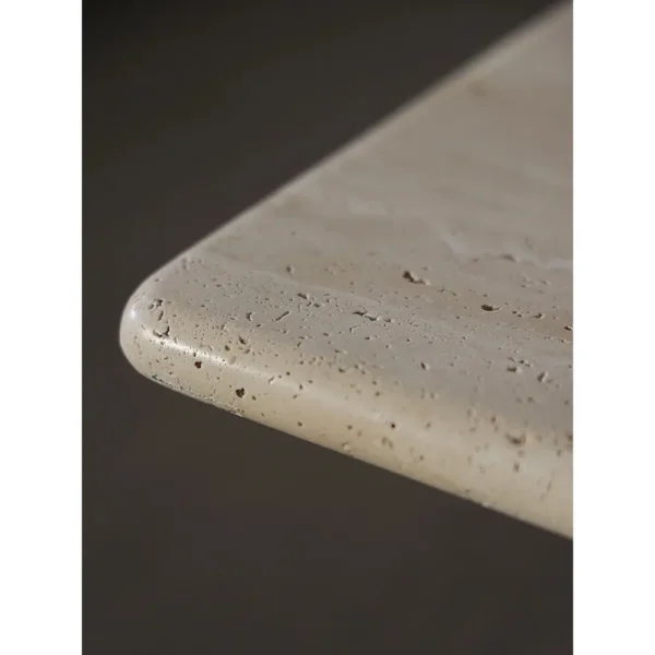 Yellow Travertine Square Coffee Table on Round Legs in sand — in a room setting