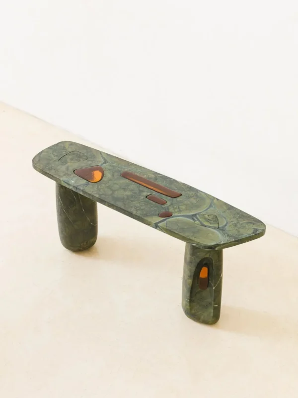 Lüye Dark Green Marble Console on Rough Stone Legs in olive — in a room setting
