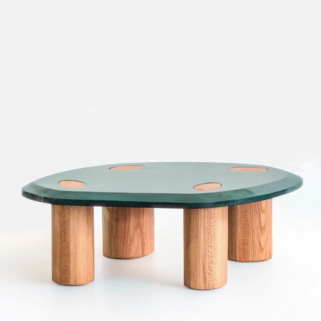 Breathing Green Coffee Table with Cut-Out Discs on Oak Legs in olive — front view