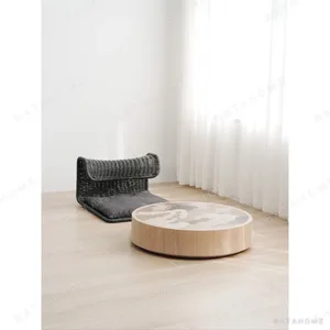 Grey Rattan Lounge Chair and Round Marbled Coffee Table Set in slate — in a room setting
