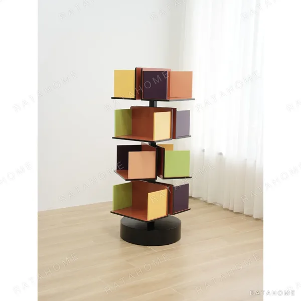 Rotating Multicolour Cube Bookcase on Black Base in multicolour — in a room setting