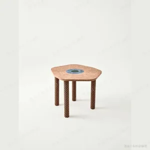 Time Slice Pink Marble Side Table in rose stone — in a room setting