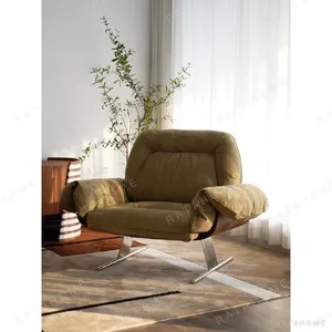 Olive Suede Lounge Chair with Wing Arms on Chrome Frame in olive — in a room setting