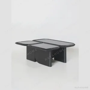 Wave Geometric Three-Tier Coffee Table in Black Wood — in a room setting
