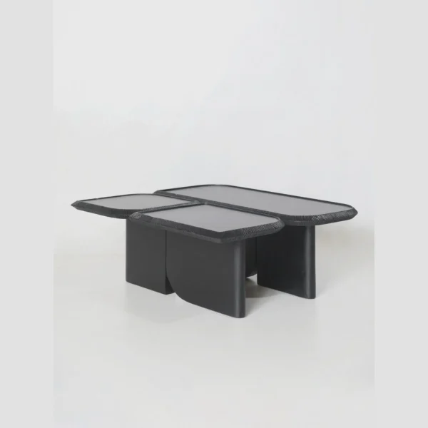 Wave Geometric Three-Tier Coffee Table in Black Wood — in a room setting