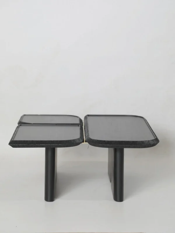 Wave Geometric Three-Tier Coffee Table in Black Wood — in a room setting