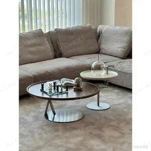 Yuanman Round Coffee Table Set with Tray Tops in black — in a room setting
