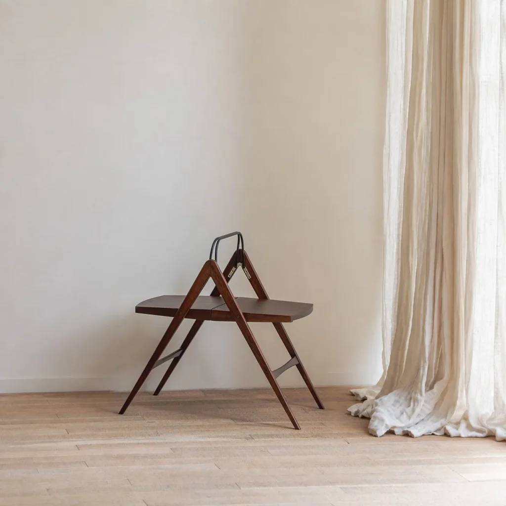 Yuban Folding Wood Side Table with Black Metal Handle in walnut — front view