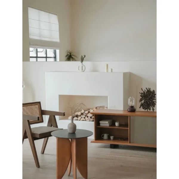 Yushu Teak and Brushed Steel Low TV Cabinet with Curved Ends in clay — in a room setting