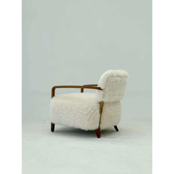 Yusol Vintage Sheepskin Lounge Chair on Walnut Frame in oatmeal — in a room setting