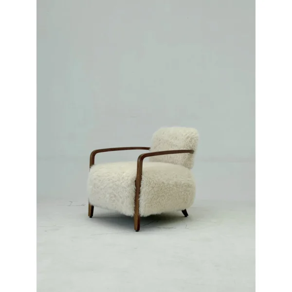 Yusol Vintage Sheepskin Lounge Chair on Walnut Frame in oatmeal — in a room setting