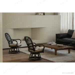 Fan-Back Rattan Swivel Lounge Chair with Cushion in clay — in a room setting