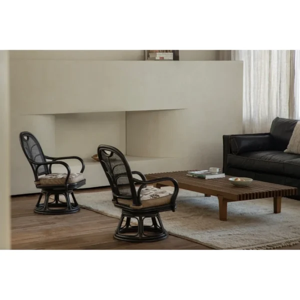 Fan-Back Rattan Swivel Lounge Chair with Cushion in clay — in a room setting