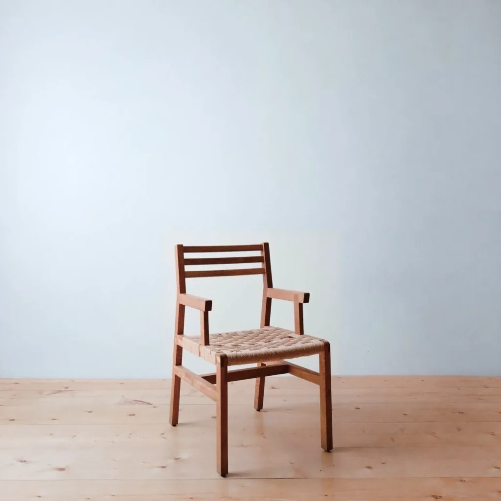 Low Solid Wood Armchair with Woven Cord Seat in clay — front view