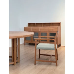 Solid Wood Dining Armchair with Mint Upholstered Seat in natural oak — in a room setting