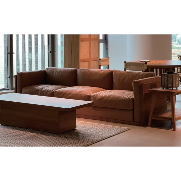 Cognac Leather Two-Seat Sofa with Leather-Wrapped Frame in clay — in a room setting
