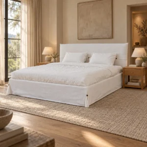 White Slipcovered Bed with Pillow Headboard in ivory — in a room setting
