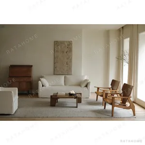 Zen Sculptural Teak Lounge Chair with Woven Seat in clay — in a room setting