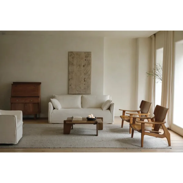 Zen Sculptural Teak Lounge Chair with Woven Seat in clay — in a room setting