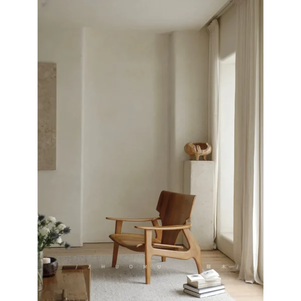 Zen Sculptural Teak Lounge Chair with Woven Seat in clay — in a room setting