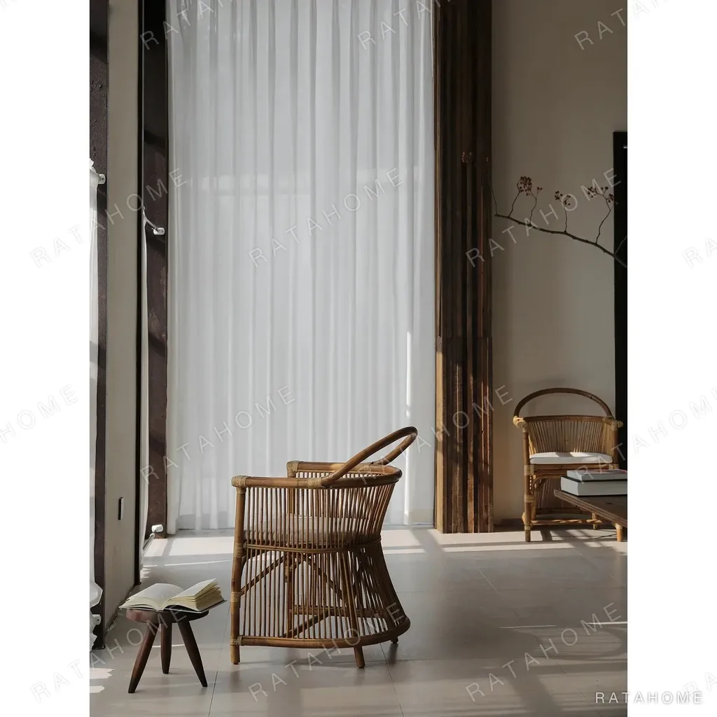 Natural Rattan Armchair with Suspended Back in natural oak — in a room setting