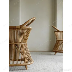 Natural Rattan Armchair with Suspended Back in natural oak — in a room setting