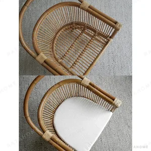 Natural Rattan Armchair with Suspended Back in natural oak — in a room setting