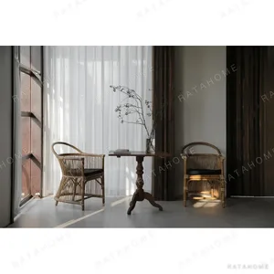 Natural Rattan Armchair with Suspended Back in natural oak — in a room setting