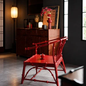 Zhuyan Vermilion Lacquered Bamboo Round-Back Armchair in red — in a room setting