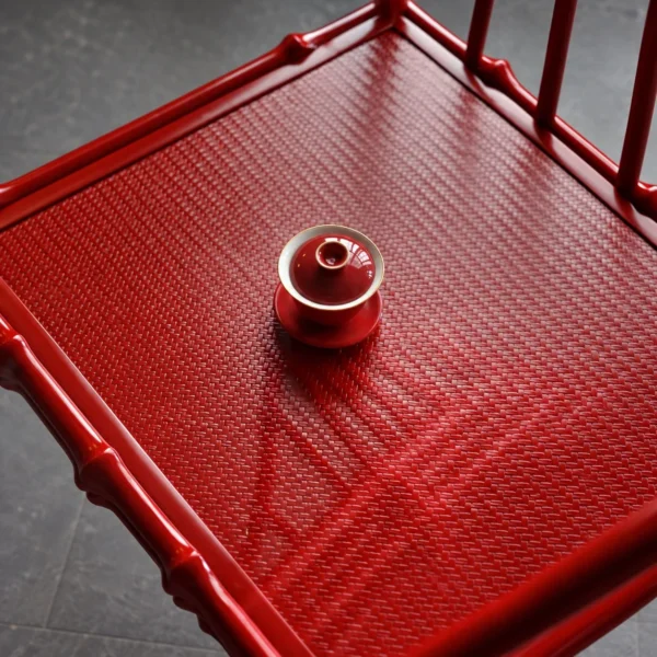 Zhuyan Vermilion Lacquered Bamboo Round-Back Armchair in red — in a room setting